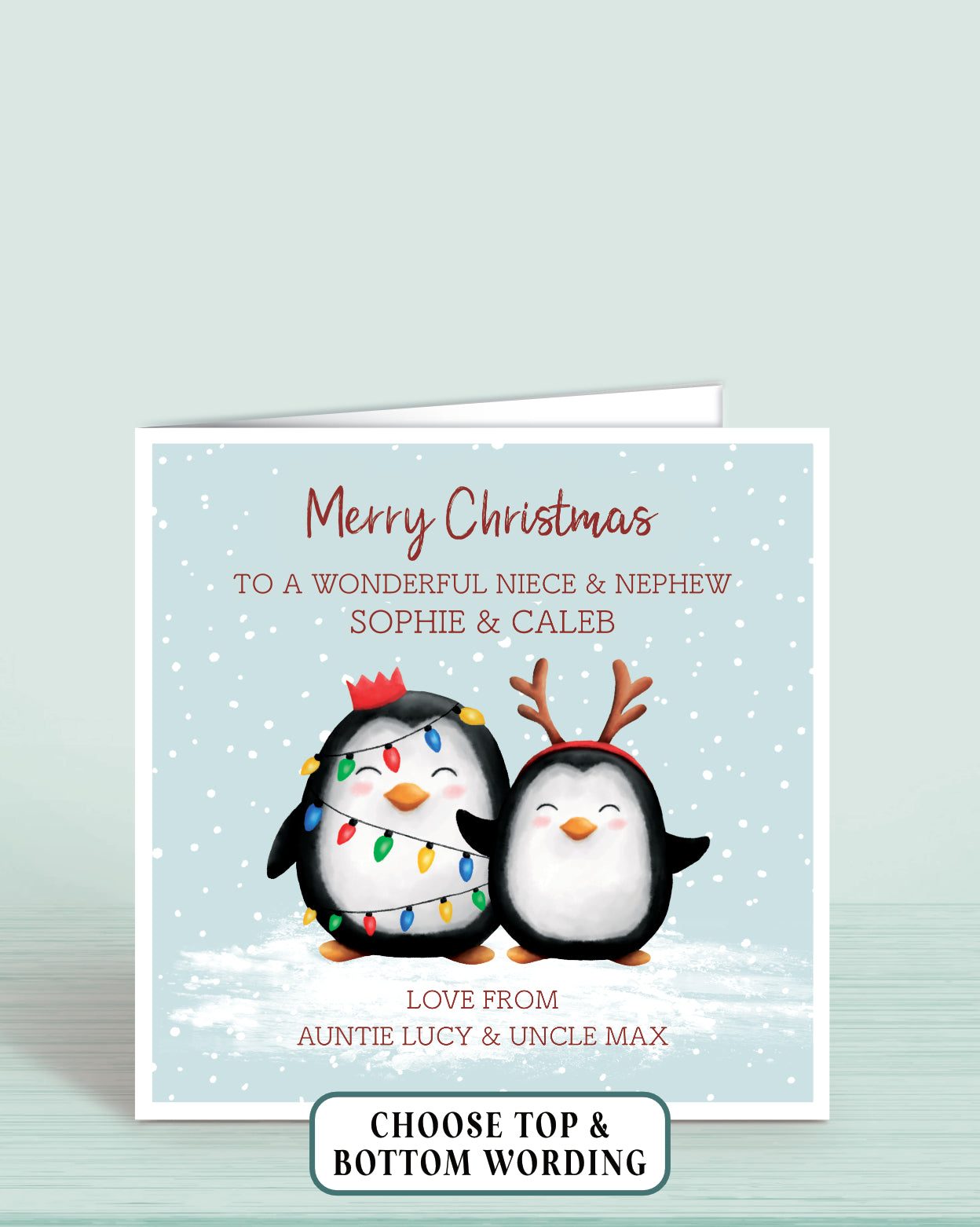 Personalised Christmas card with two cheeky penguins holding christmas lights on a light blue snowy background, 6x6 inches with envelope