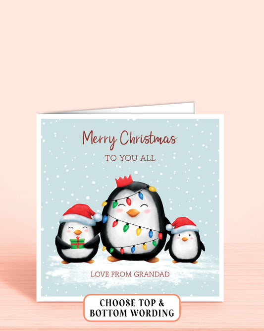 Personalised Christmas card with three cheeky penguins holding christmas lights on a light blue snowy background, 6x6 inches with envelope