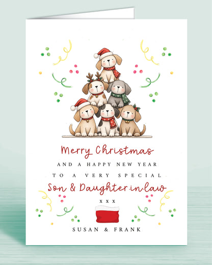 A Dog Lovers christmas card with a stack of christmas tree shaped Puppies and text underneath that reads: Merry Christmas and a happy new year to a very special son & daughter-in-law xxx - Names are optional.