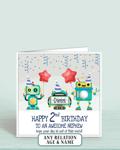 Birthday card with robots holding balloons and text on a light grey background. Reads: Happy 2nd Birthday to an awesome Nephew Hope your day is out of this world, add childs name if required | Oliver Rose Designs