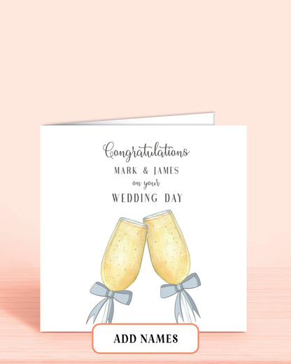 Wedding Day card with Printed Champagne Glasses with Blue Bows. Words on front: Congratulations [Couples Names] on your Wedding Day.